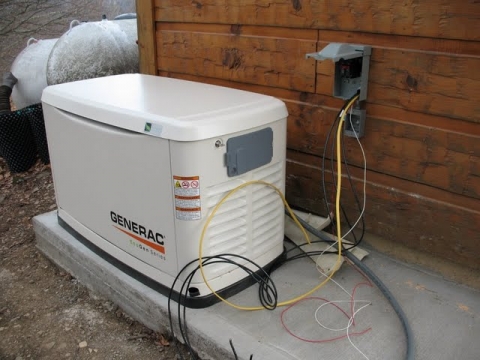 Switch box to transfer between main generator (shown) and a backup/portable option.