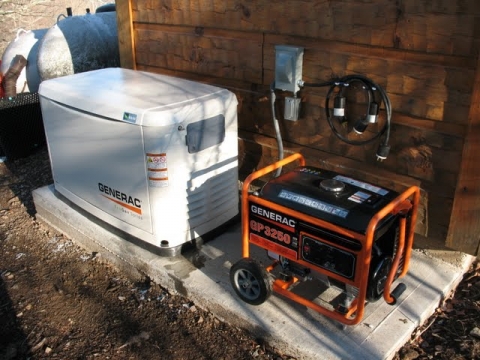 The complete generator set-up is shown. The automatic generator is to the left, the portable backup generator to the right.