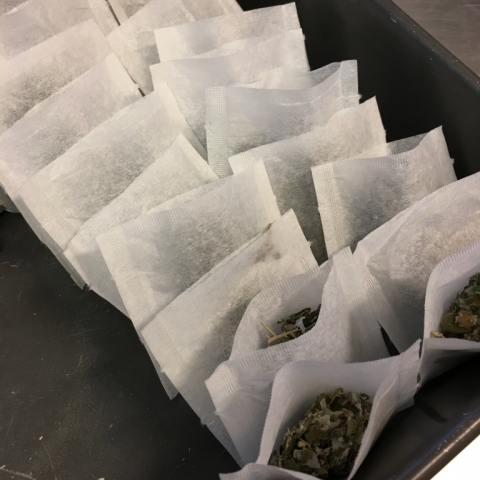 Filled tea bags ready for ironing.