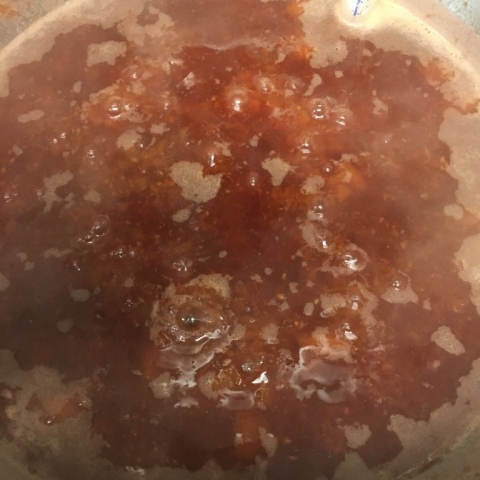 Peach raspberry preserves in the making.