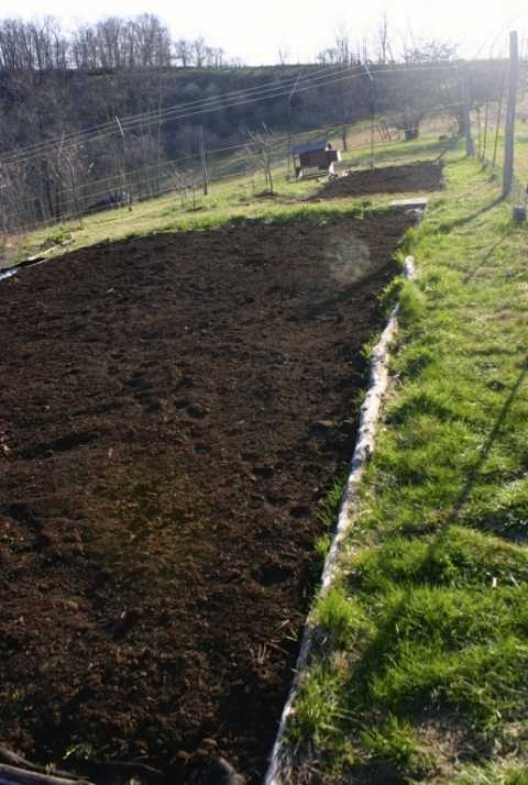 Garden beds covered with compost April 25.