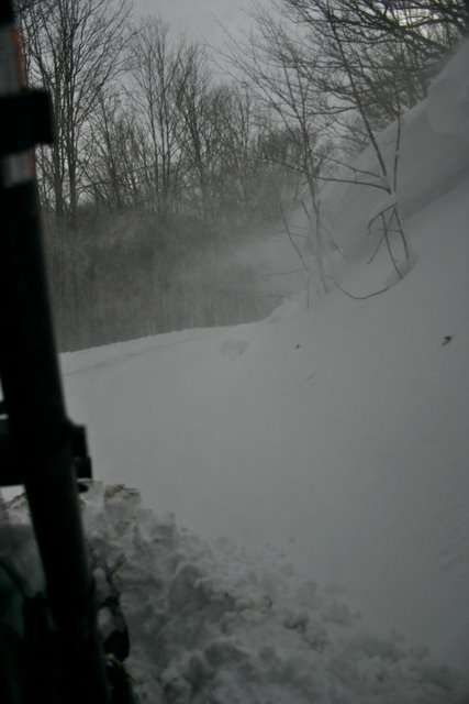 The plow blade creates a snow wake